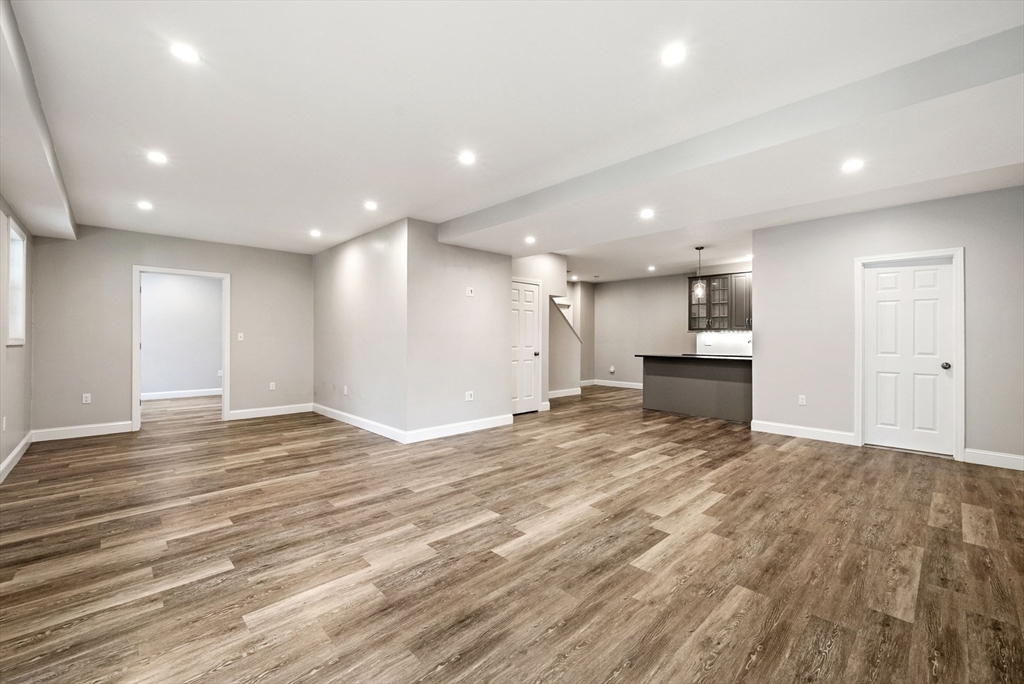 45 Saddleback Lane Canton, MA 02021 - Photo 29 of 42 a view of an empty room with wooden floor