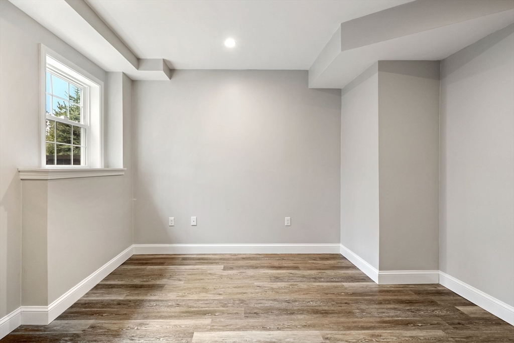 45 Saddleback Lane Canton, MA 02021 - Photo 32 of 42 a view of a room with wooden floor and window