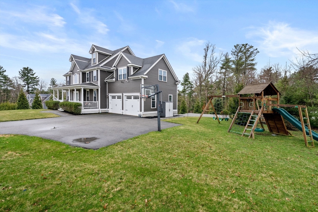 45 Saddleback Lane Canton, MA 02021 - Photo 34 of 42 a view of a house with a yard and sitting area