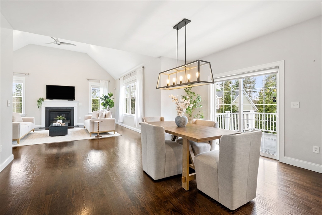 45 Saddleback Lane Canton, MA 02021 - Photo 6 of 42 a view of a dining room and livingroom with furniture wooden floor a chandelier