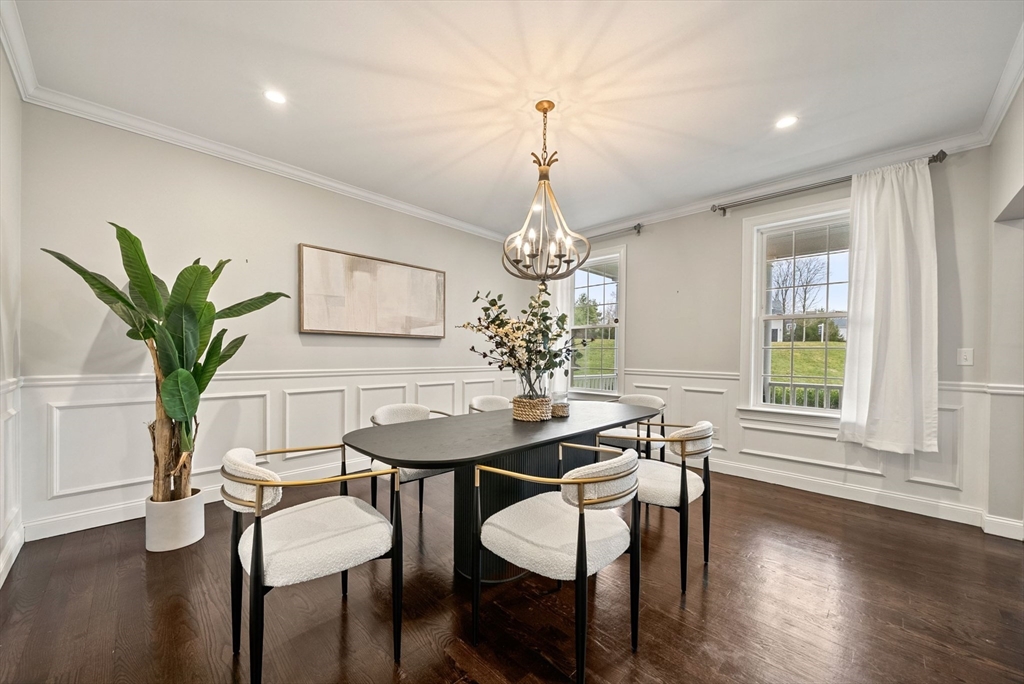 45 Saddleback Lane Canton, MA 02021 - Photo 10 of 42 a view of a dining room with furniture window and wooden floor