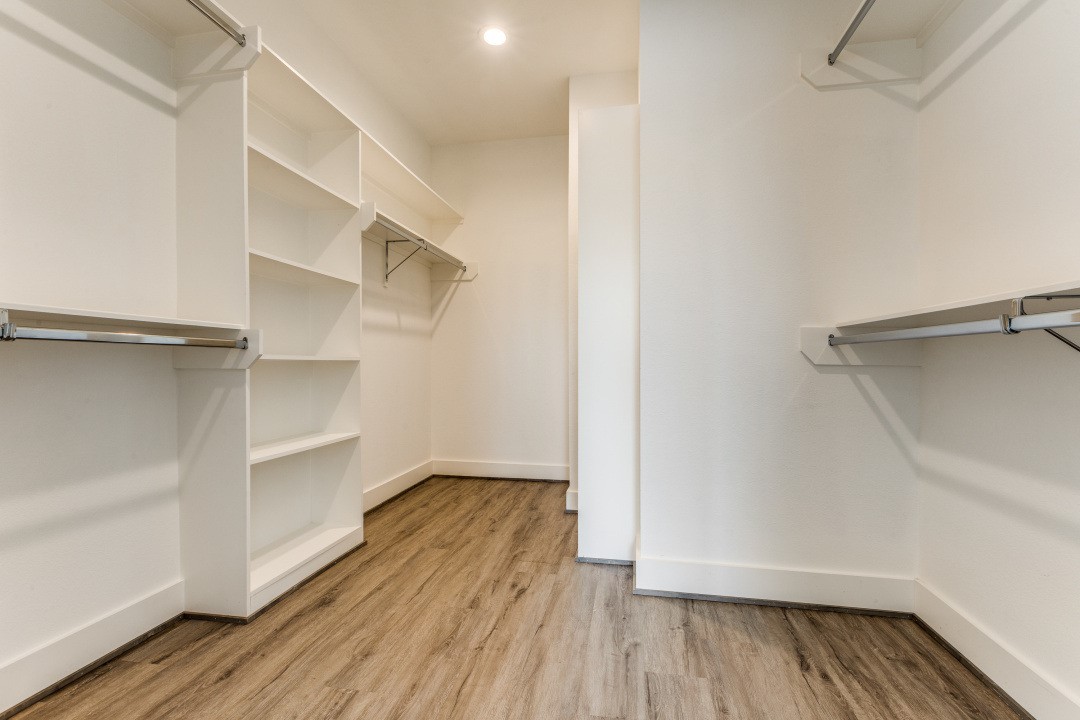 728 East 38th Street Houston, TX 77022 - Photo 9 of 18 Spacious walk-in closet with ample shelving and hanging space, perfect for organizing clothes and accessories.