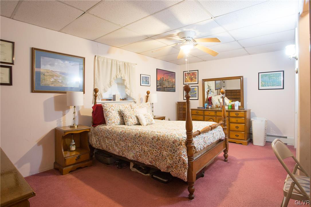 222 Cherry Hill Road Nazareth, PA 18064 - Photo 12 of 31 a spacious bedroom with a bed and a cabinets
