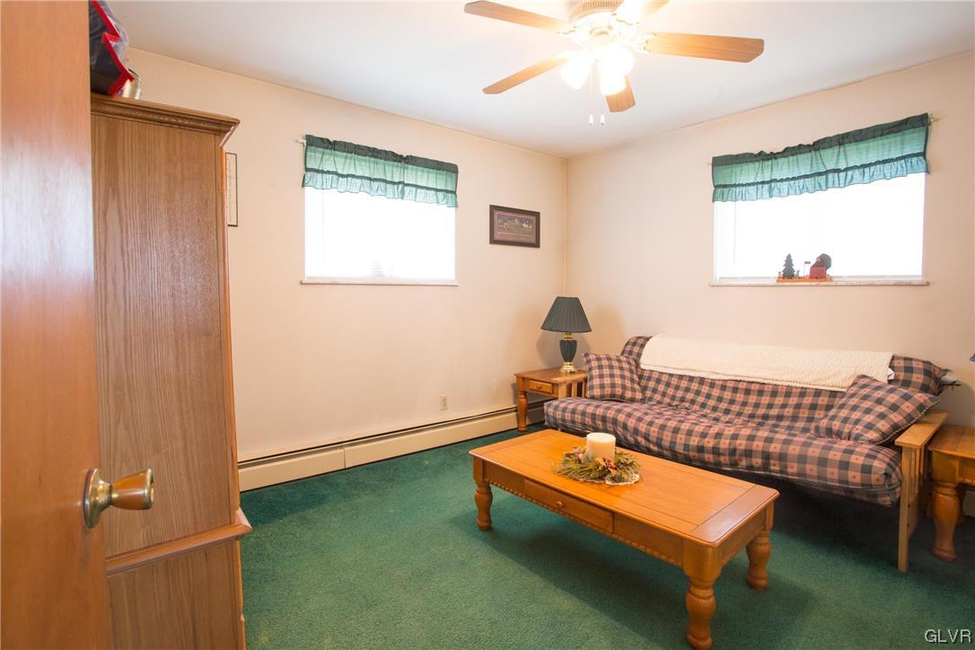 222 Cherry Hill Road Nazareth, PA 18064 - Photo 19 of 31 a living room with furniture and a table