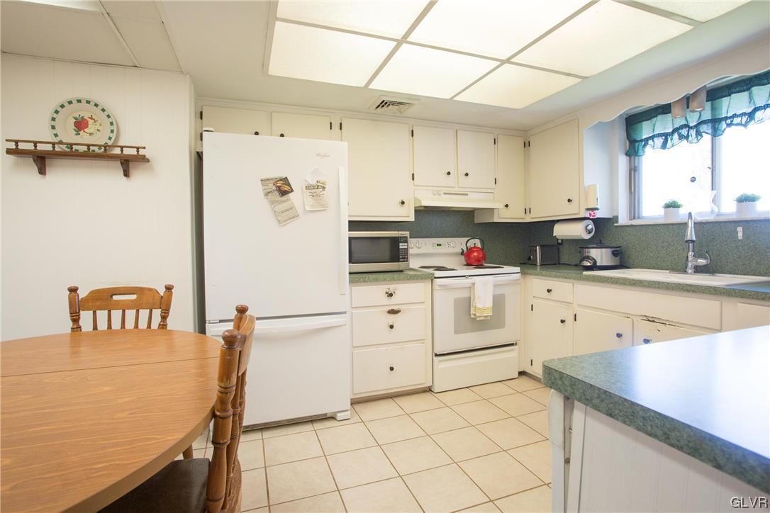 222 Cherry Hill Road Nazareth, PA 18064 - Photo 2 of 31 a kitchen with white cabinets and white appliances