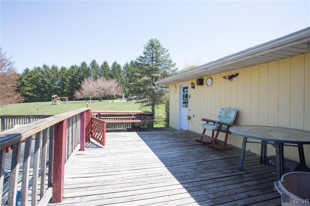 222 Cherry Hill Road Nazareth, PA 18064 - Photo 24 of 31 a balcony with wooden floor table and chairs
