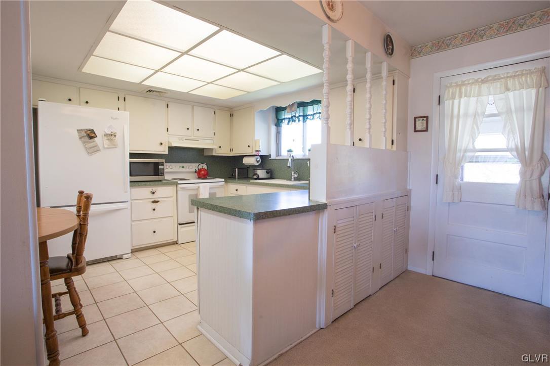 222 Cherry Hill Road Nazareth, PA 18064 - Photo 3 of 31 a kitchen with cabinets appliances a sink and a window