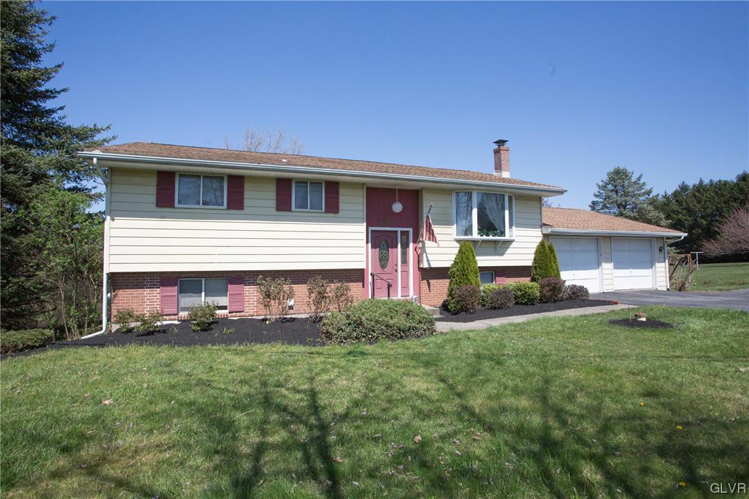 222 Cherry Hill Road Nazareth, PA 18064 - Photo 31 of 31 a front view of a house with a garden and yard