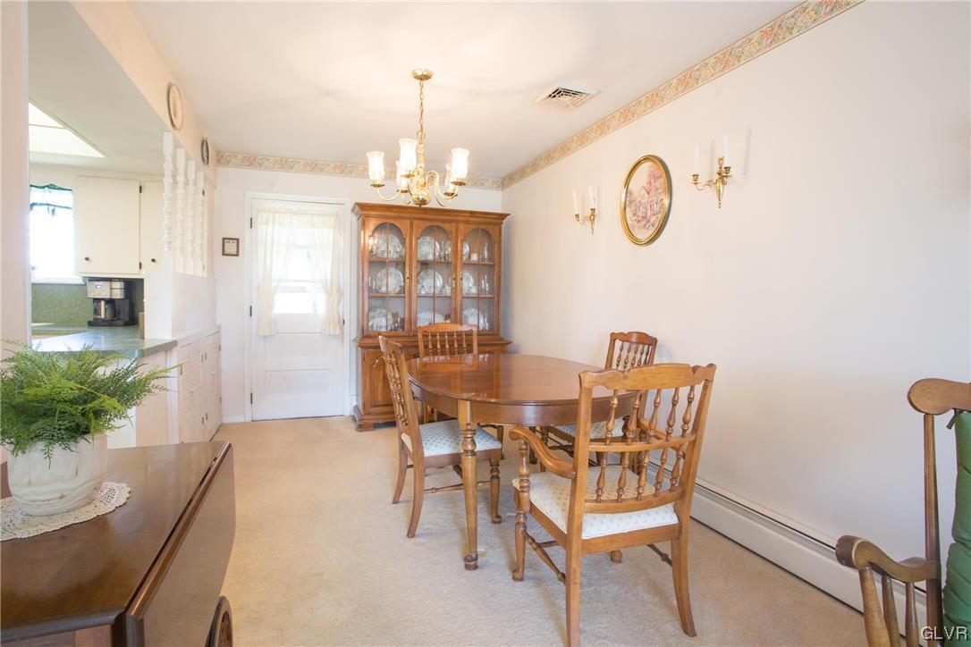 222 Cherry Hill Road Nazareth, PA 18064 - Photo 4 of 31 a view of a dining room with furniture and a chandelier