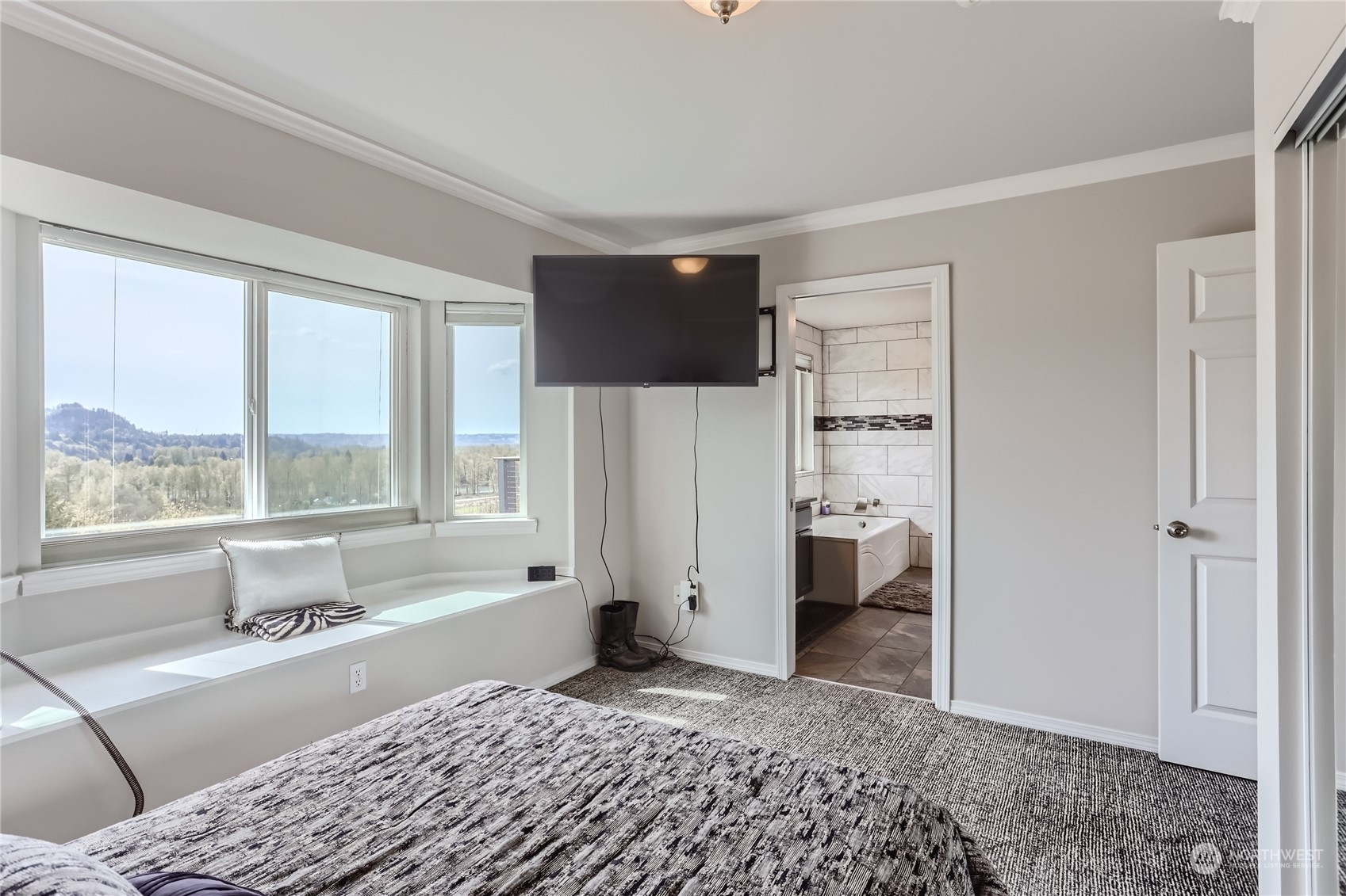 21712 Calhoun Road Monroe, WA 98272 - Photo 12 of 37 a large bedroom with a bed and a large window