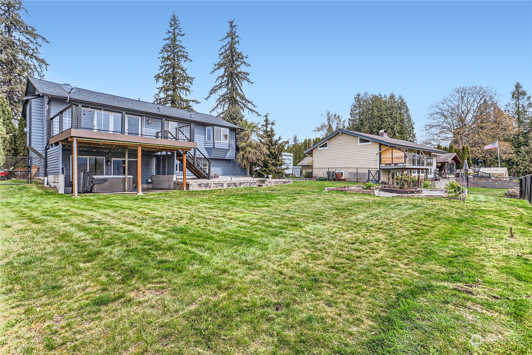 21712 Calhoun Road Monroe, WA 98272 - Photo 24 of 37 a view of a house with a yard porch and sitting area