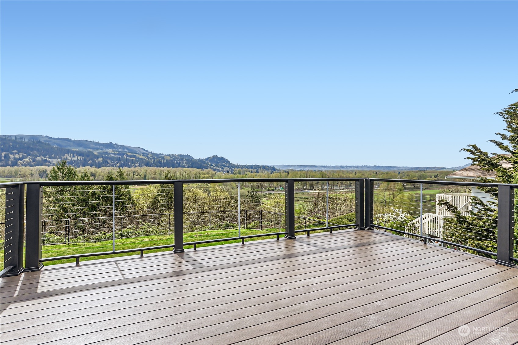21712 Calhoun Road Monroe, WA 98272 - Photo 10 of 37 a view of a terrace with wooden floor and mountain view