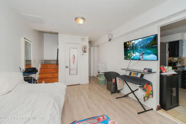 a bedroom with a bed and a dresser