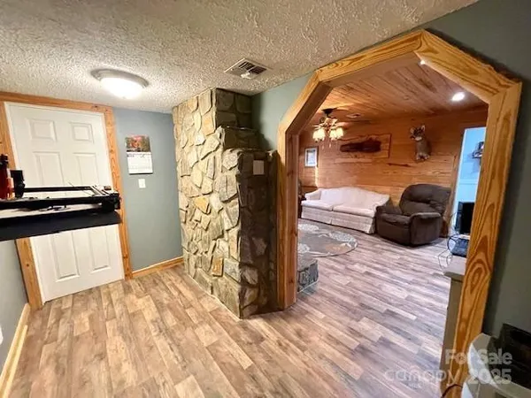 a bedroom with a bed and a ceiling fan