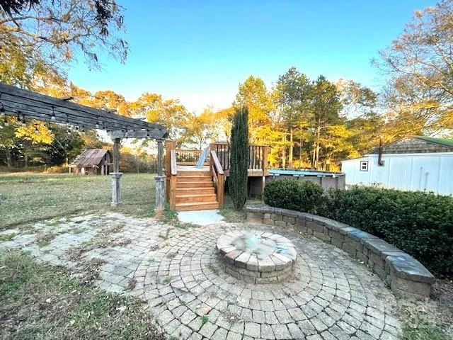 a view of a chairs and table in the patio