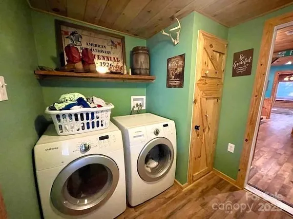 a view of a house with a yard covered with snow in the background