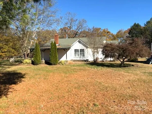 a view of outdoor space with deck and trees
