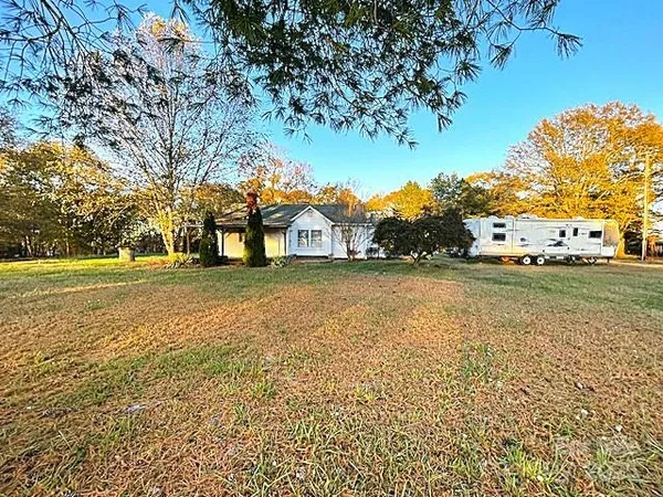 a house with trees in the background