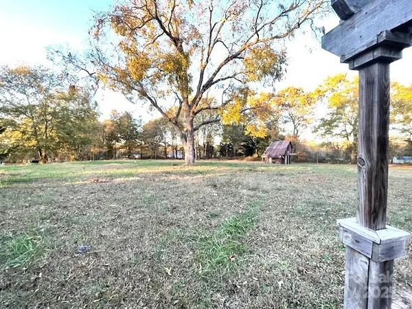 a view of a house with a yard and garage