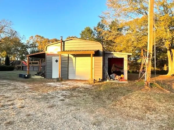 a view of backyard with large trees