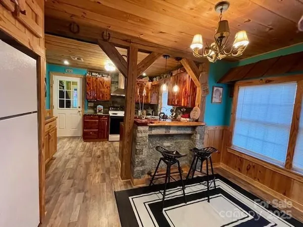 a kitchen with stainless steel appliances a stove and a refrigerator