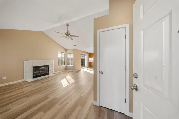 wooden floor in an empty room with a fireplace