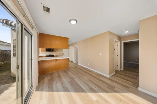 a view of kitchen with wooden floor