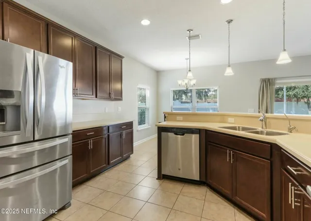 a view of storage and utility room with washer and dryer