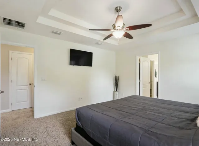 a bathroom with a tub a sink and mirror