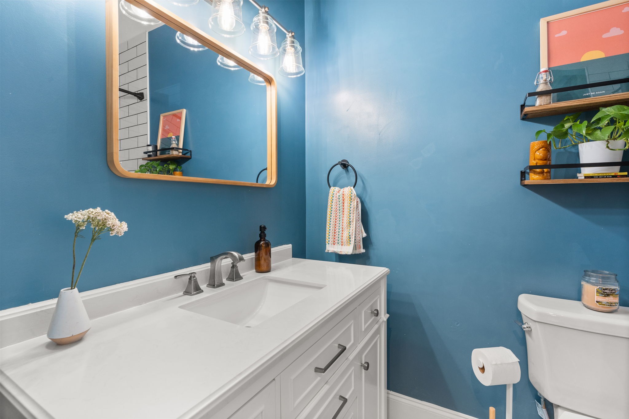414 Sloan Road Nashville, TN 37209 - Photo 12 of 16 a bathroom with a toilet sink and mirror