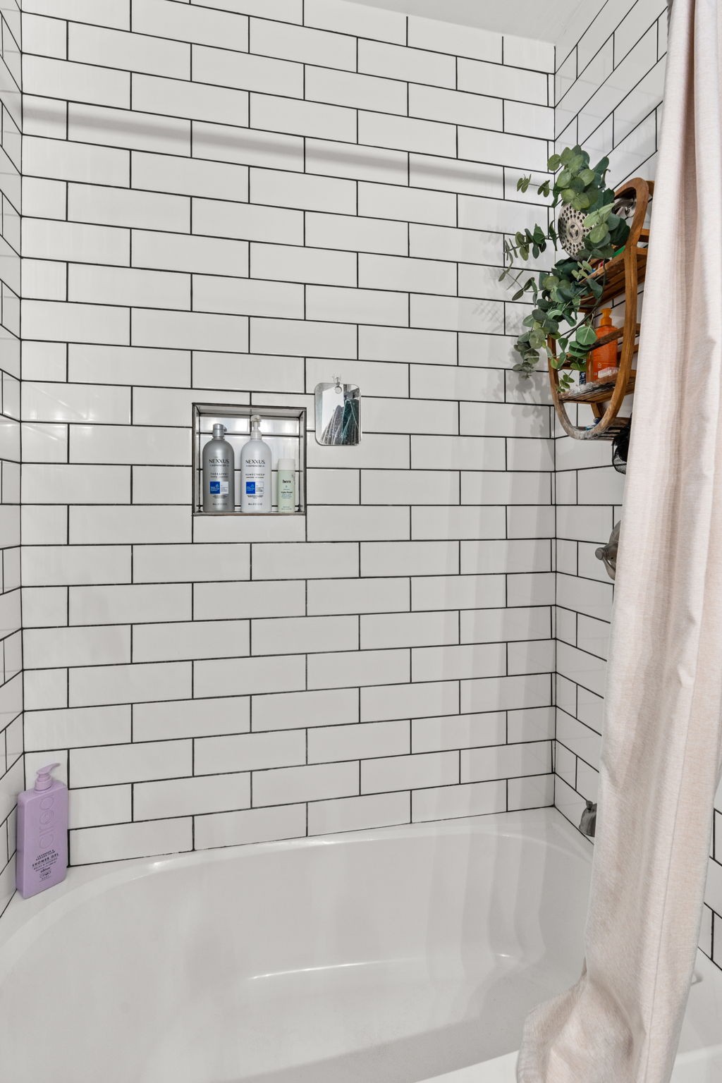 414 Sloan Road Nashville, TN 37209 - Photo 13 of 16 a bathroom with a bathtub and a shower