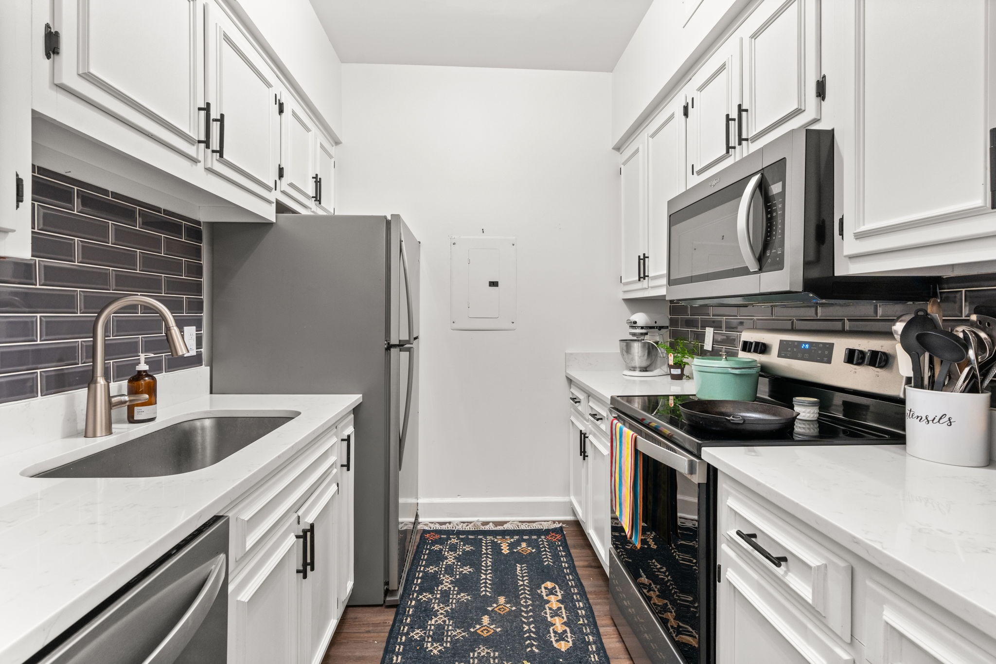 414 Sloan Road Nashville, TN 37209 - Photo 8 of 16 a kitchen with stainless steel appliances granite countertop a sink stove and refrigerator