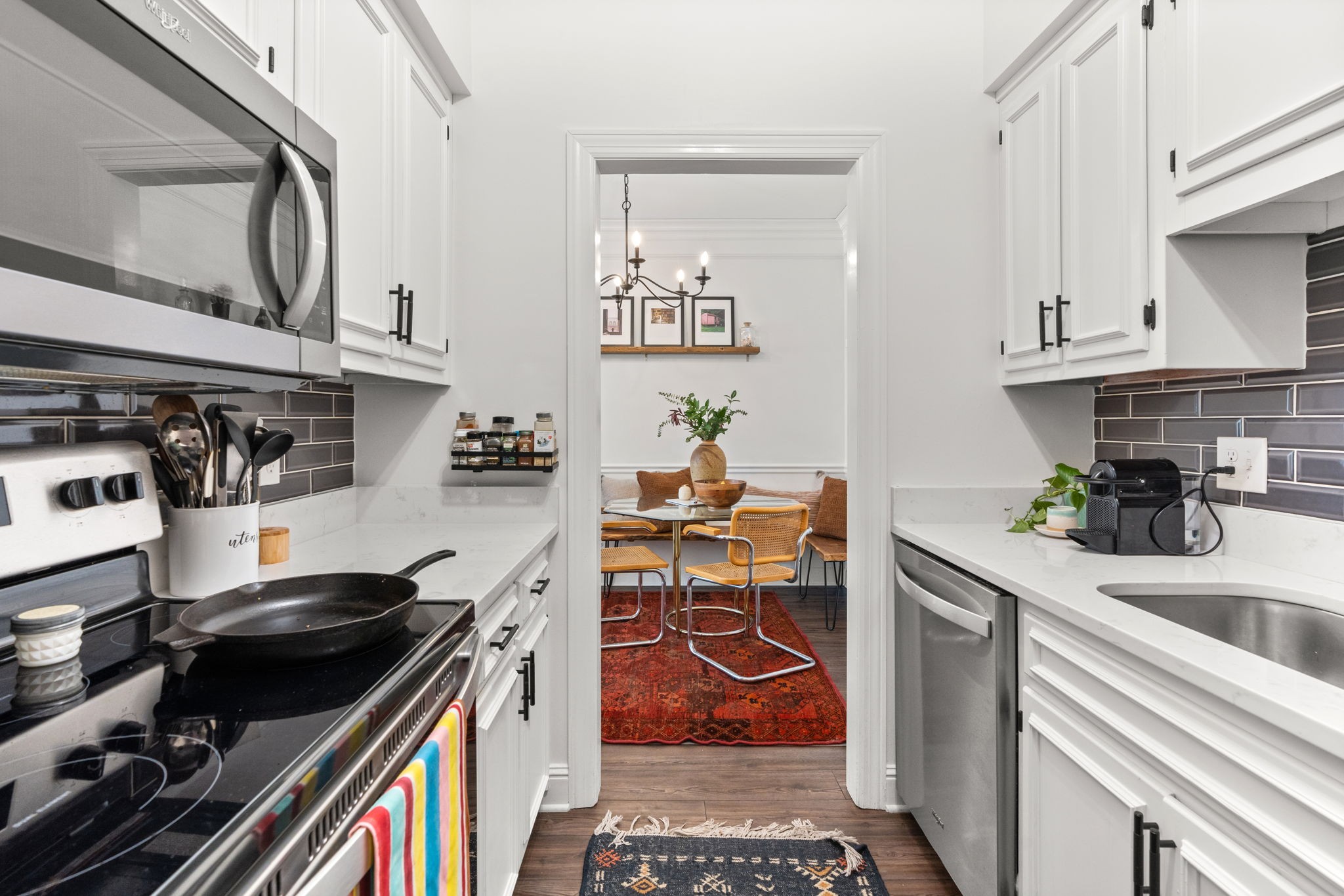 414 Sloan Road Nashville, TN 37209 - Photo 9 of 16 a kitchen with stainless steel appliances a stove a sink and cabinets