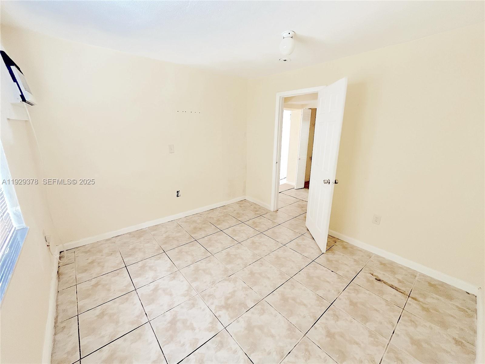 236 East 14th Street, Unit B Hialeah, FL 33010 - Photo 15 of 16 a view of a room with white walls