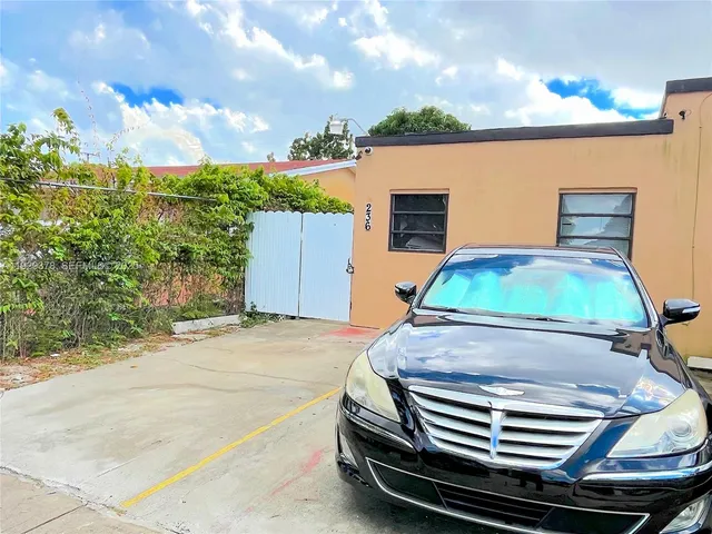 a car parked in front of a house