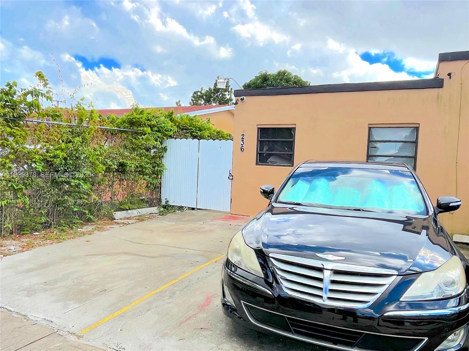 236 East 14th Street, Unit B Hialeah, FL 33010 - Photo 2 of 16 a view of a backyard with sitting area