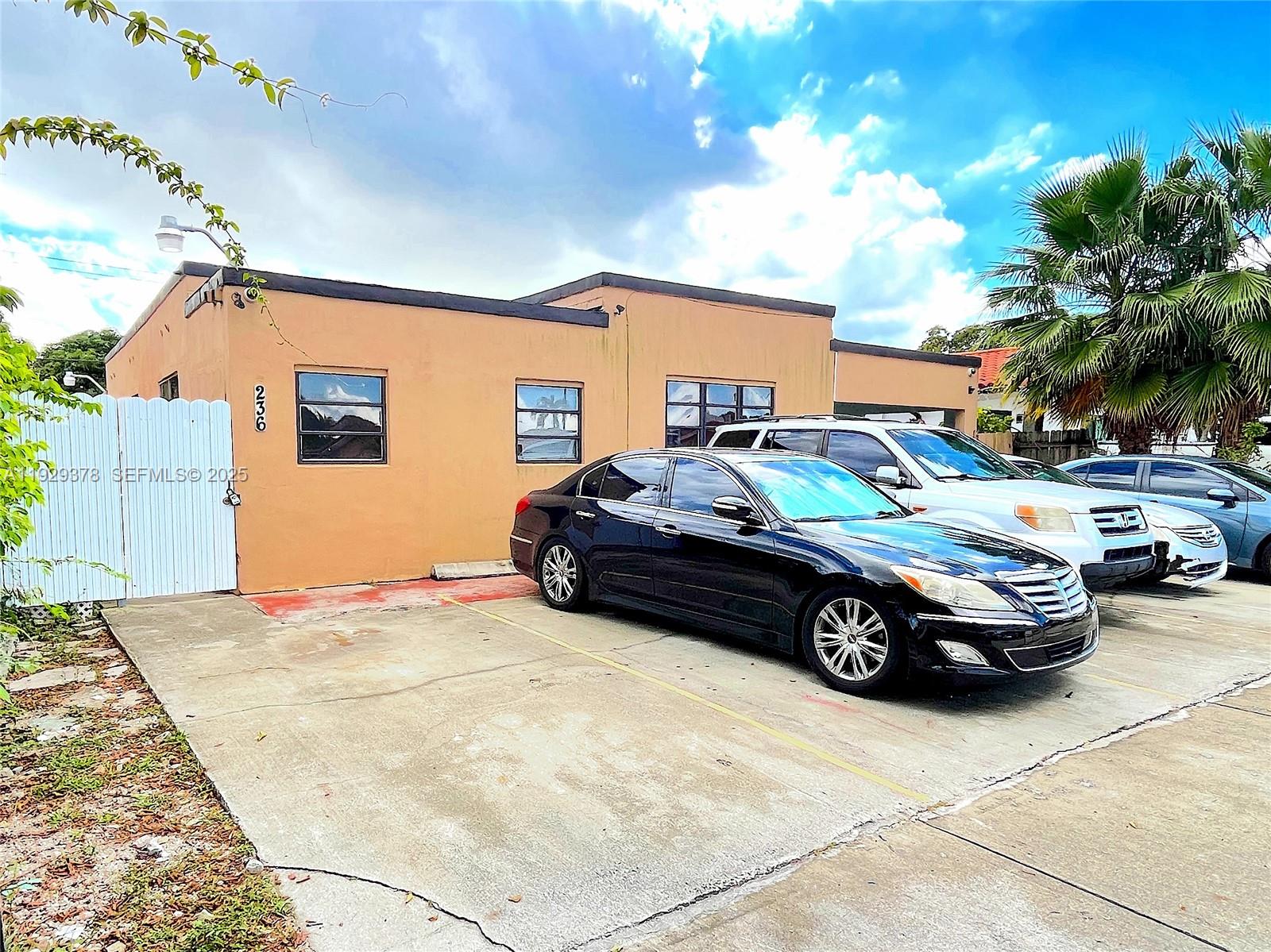236 East 14th Street, Unit B Hialeah, FL 33010 - Photo 3 of 16 a car parked in front of a house
