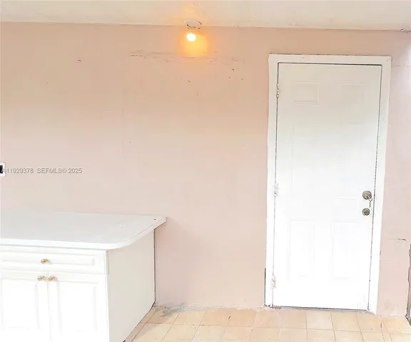 a view of a kitchen with a sink and a microwave