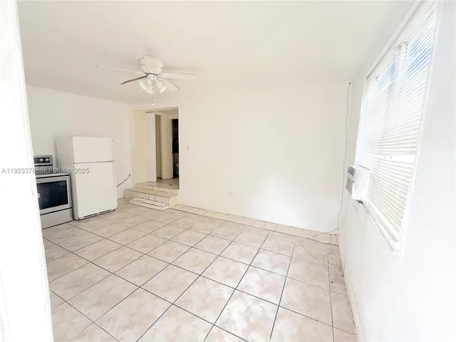 a kitchen with a stove a sink and a microwave