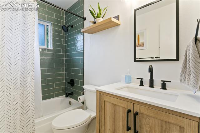 4710 Cheerful Road Colorado Springs, CO 80917 - Photo 25 of 28 Full bathroom featuring vanity and shower / bath combo