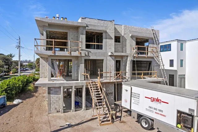 a view of a building with outdoor seating