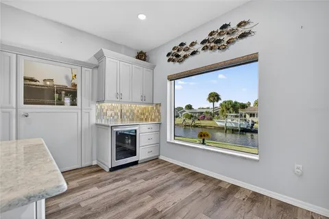 a view of a big room with windows and fan