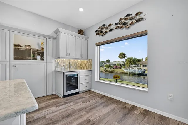 a view of a big room with windows and fan