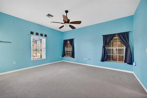 a spacious bathroom with a tub shower and a sink