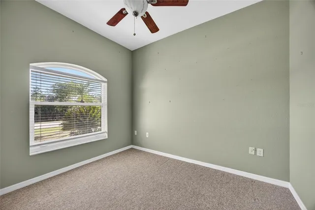 a bathroom with a granite countertop sink a toilet and a mirror