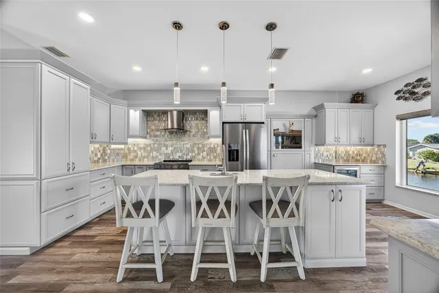 a kitchen with a stove and a sink