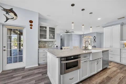 a open kitchen with a sink and dish washer
