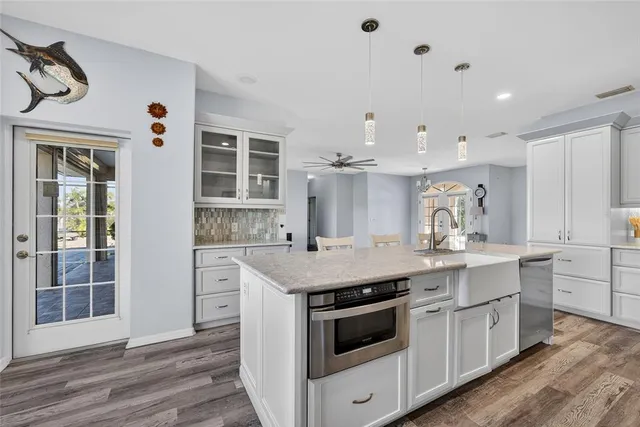 a open kitchen with a sink and dish washer