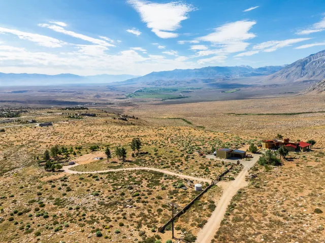 a view of a big yard with lots of green space