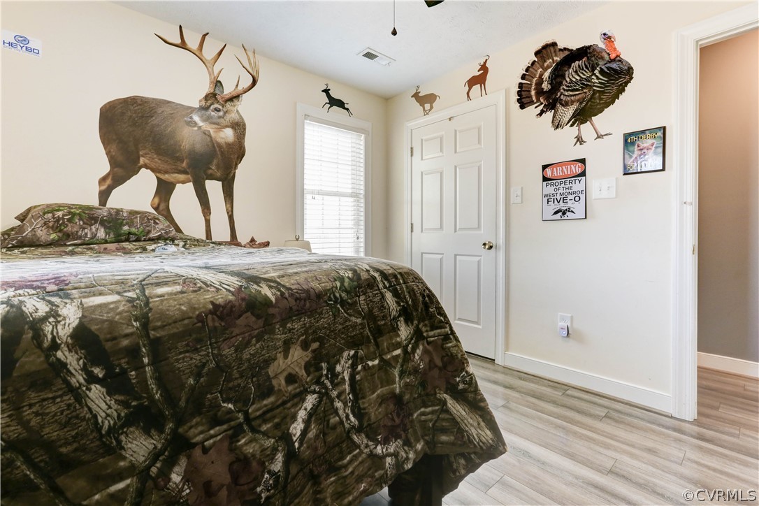 384 Landing Road Manquin, VA 23106 - Photo 21 of 47 Bedroom with Ceiling Fan and LVT flooring.